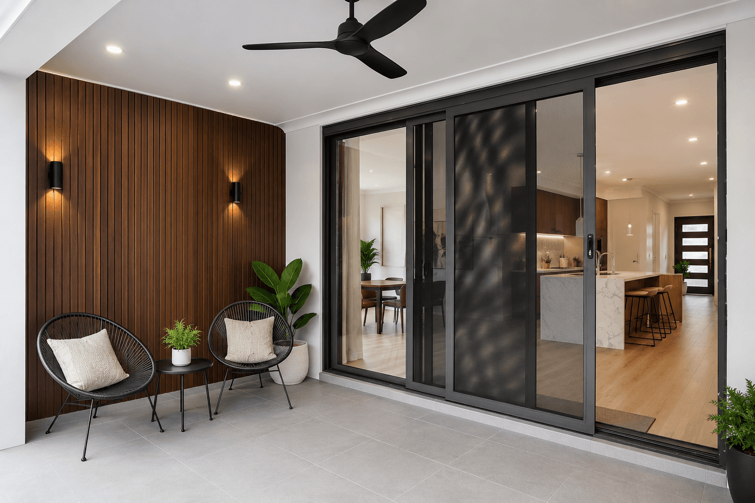 Modern patio with sliding security doors opening to a Melbourne home